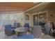 Relaxing patio features seating area, fire pit, and shade awning at 955 S Henry Ln, Gilbert, AZ 85296