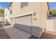 Attached two-car garage with light beige doors at 955 S Henry Ln, Gilbert, AZ 85296