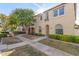 Two-story tan house with a walkway and landscaping at 955 S Henry Ln, Gilbert, AZ 85296