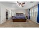 Main bedroom with wood platform bed and walk-in closet at 955 S Henry Ln, Gilbert, AZ 85296