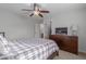 Well-lit bedroom with a comfortable bed and dresser at 955 S Henry Ln, Gilbert, AZ 85296