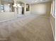 Formal dining room with carpet flooring and chandelier at 15818 W Mercer Ln, Surprise, AZ 85379