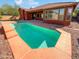 Inviting rectangular pool with surrounding patio at 15818 W Mercer Ln, Surprise, AZ 85379