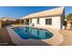 Inviting kidney-shaped pool with a large backyard at 13355 W Virginia Ave, Goodyear, AZ 85395