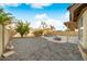 Landscaped backyard with gravel and a kidney-shaped pool at 16800 W Mesquite Dr, Goodyear, AZ 85338