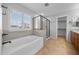 Bathroom features a soaking tub, shower, and double vanity at 16800 W Mesquite Dr, Goodyear, AZ 85338