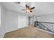 Large bedroom with double doors and ceiling fan at 16800 W Mesquite Dr, Goodyear, AZ 85338