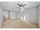 Spacious bedroom with carpeted floor and ceiling fan at 16800 W Mesquite Dr, Goodyear, AZ 85338