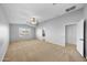 Large bedroom with ceiling fan and access to bathroom at 16800 W Mesquite Dr, Goodyear, AZ 85338