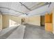 Spacious garage with built-in cabinets and refrigerator at 16800 W Mesquite Dr, Goodyear, AZ 85338