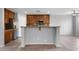 Kitchen with wood cabinets, granite countertops, and an island at 16800 W Mesquite Dr, Goodyear, AZ 85338