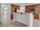 Modern kitchen features granite countertops, stainless steel appliances, and ample wood cabinets at 16800 W Mesquite Dr, Goodyear, AZ 85338