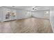 Large living room with tile flooring and French doors leading to the backyard at 16800 W Mesquite Dr, Goodyear, AZ 85338