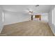 Open living room with tile floors and views to the kitchen and backyard at 16800 W Mesquite Dr, Goodyear, AZ 85338