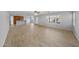 Open concept living room with tile floors and kitchen views at 16800 W Mesquite Dr, Goodyear, AZ 85338