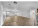 Spacious living room with tile flooring, and views to the kitchen and backyard at 16800 W Mesquite Dr, Goodyear, AZ 85338