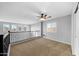 Bright loft bedroom with ceiling fan and large windows at 16800 W Mesquite Dr, Goodyear, AZ 85338