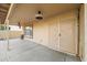 Covered patio with ceiling fans and access to backyard at 16800 W Mesquite Dr, Goodyear, AZ 85338