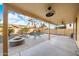 Inviting backyard oasis with a sparkling pool and covered patio at 16800 W Mesquite Dr, Goodyear, AZ 85338