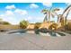 Sparkling pool with a waterfall feature and ample patio space at 16800 W Mesquite Dr, Goodyear, AZ 85338
