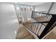 Elegant staircase with wrought iron railings leading to the upper level at 16800 W Mesquite Dr, Goodyear, AZ 85338