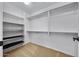Spacious walk-in closet with ample shelving and hanging space at 16800 W Mesquite Dr, Goodyear, AZ 85338
