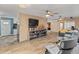 Living area featuring built-in shelving and comfortable seating at 10428 W Meade Dr, Sun City, AZ 85351