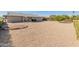 Large backyard with gravel and covered patio at 10428 W Meade Dr, Sun City, AZ 85351