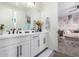 Modern bathroom with double vanity and view of bedroom at 11288 N San Clemente St, Surprise, AZ 85388