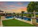 Stunning pool and spa area with lush landscaping and beautiful sunset views at 11288 N San Clemente St, Surprise, AZ 85388