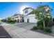 Stunning two-story home with a modern farmhouse design and landscaped yard at 11288 N San Clemente St, Surprise, AZ 85388