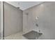 Large walk-in shower with dual shower heads and modern tile at 1859 N Morris --, Mesa, AZ 85201