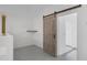 Hallway with barn door and tile floors at 1859 N Morris --, Mesa, AZ 85201