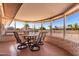 Bright sunroom with table and chairs, offering view of backyard at 17402 N 98Th Ave, Sun City, AZ 85373