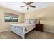 Bright bedroom with ceiling fan and double bed at 17402 N 98Th Ave, Sun City, AZ 85373