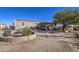 Single-wide mobile home with covered porch and garden at 2005 N 196Th Dr, Buckeye, AZ 85396