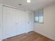 Bright bedroom with ample closet space and wood-look flooring at 1730 W Emelita Ave # 2033, Mesa, AZ 85202