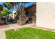 Exterior view of condo building with stairs and landscaping at 520 N Stapley Dr # 193, Mesa, AZ 85203