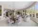 Open concept dining area with a glass table and mountain views at 42315 N Olympic Fields Ct, Anthem, AZ 85086