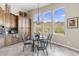 Breakfast nook with glass table and mountain views at 42315 N Olympic Fields Ct, Anthem, AZ 85086