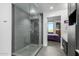 Spa-like bathroom with a large glass shower and a view of the bedroom at 200 W Portland St # 614, Phoenix, AZ 85003