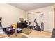 Bright bedroom with double door closet and tile flooring at 3922 W Aire Libre Ave, Phoenix, AZ 85053