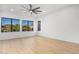 Spacious bedroom with large windows and hardwood floors at 10646 E Butherus Dr, Scottsdale, AZ 85255