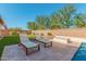 Relaxing patio with lounge chairs near pool at 1960 E Blackhawk Dr, Gilbert, AZ 85298