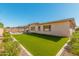 Artificial turf backyard with home view at 1960 E Blackhawk Dr, Gilbert, AZ 85298