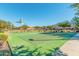 Green basketball court with marked lines and hoops at 1960 E Blackhawk Dr, Gilbert, AZ 85298