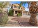 Two-story house with a landscaped front yard and double-car garage at 10468 W Palm Ln, Avondale, AZ 85392