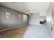 Spacious living room with neutral walls and plush carpeting at 10468 W Palm Ln, Avondale, AZ 85392