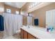 Clean bathroom with shower, toilet, and vanity at 10468 W Palm Ln, Avondale, AZ 85392