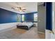 Spacious bedroom with a ceiling fan, neutral walls, and carpeted floors at 10468 W Palm Ln, Avondale, AZ 85392